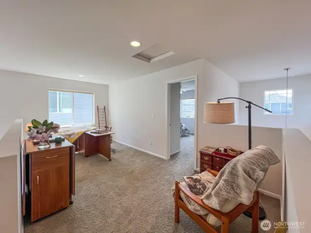 The loft is multi-functional- it can become multiple hobby spaces, workstations, reading nooks, an entertainment corner complete with a couch and large screen tv- or a perfect spot for a daybed (with a trundle!) for visitors.