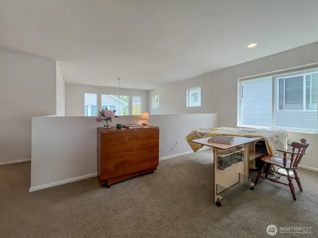The loft is not only steps from the 2 upstairs bedrooms- it also overlooks the great room area below.