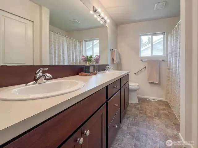 Between the loft and one of the upstairs bedrooms is large, bright, meticulously maintained full bath. Also featuring 2 vanity sinks!