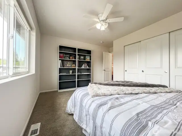 Another view of the upstairs bedroom- phenomenal wall space for built ins, or a work-station with a large screen tv.