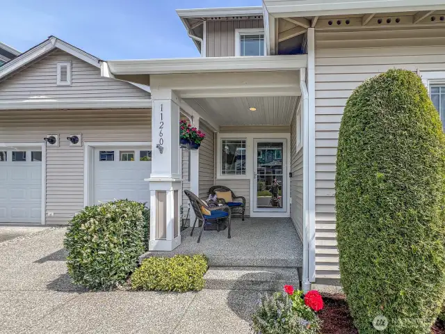 West facing front patio for enjoying morning coffee, socializing, or taking in beautiful sunsets.