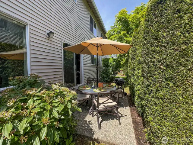 Cozy entertaining with convenient access to the kitchen and/or outdoor grilling. Every bit of space is thought out and functional!