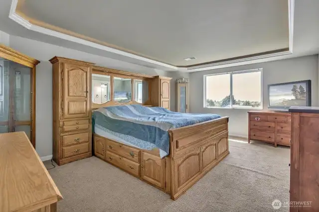 Light and bright primary bedroom with ambient lighting.