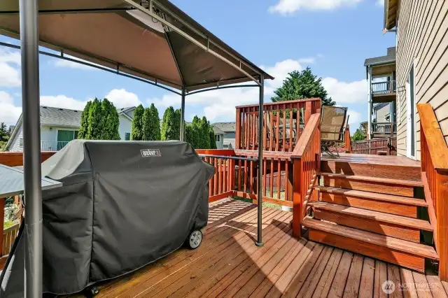 Lower tier of deck with area for covered grill