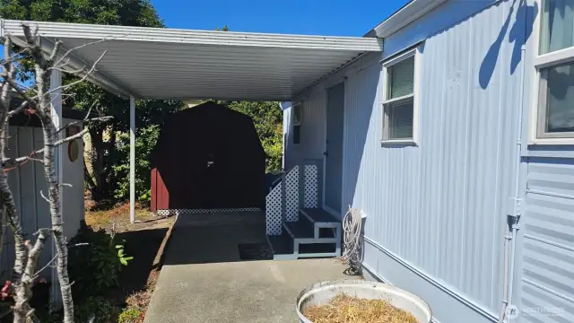 Side of home with Shed