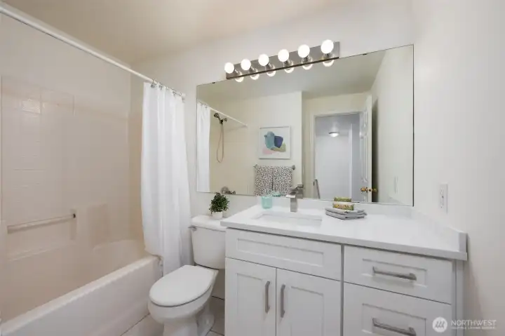 Second bathroom with shower / tub combo. New vanity, counter top and paint