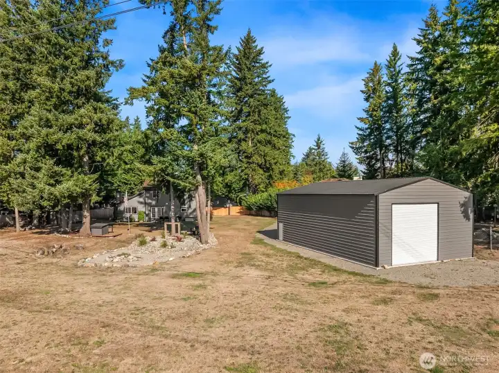 Massive detached building perfect for car collection, RV storage, workshop, or game room.