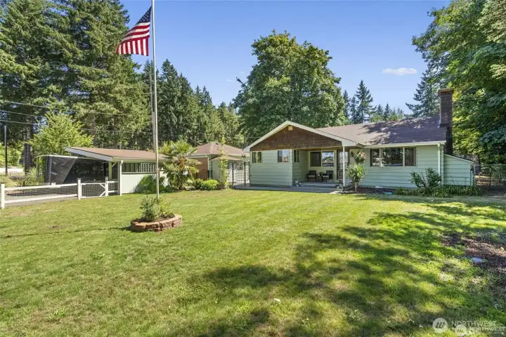 Over sized fully fenced front yard.