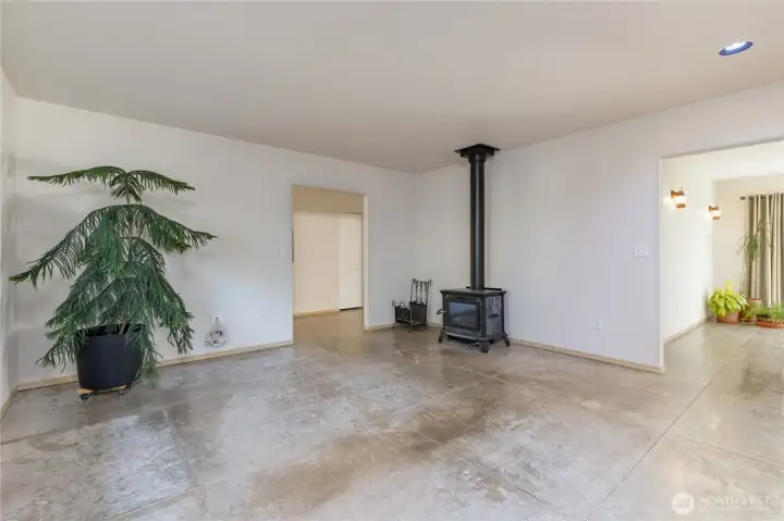 Living room features a cozy wood-burning stove