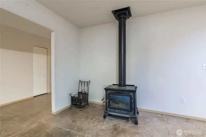 Efficient soapstone wood-burning stove offers lasting, even heat and timeless rustic charm