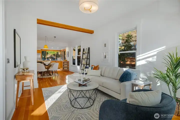 the gorgeous fir floors carry into the sunlit living room