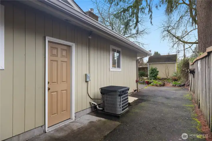 Side Yard and Man Door to Garage