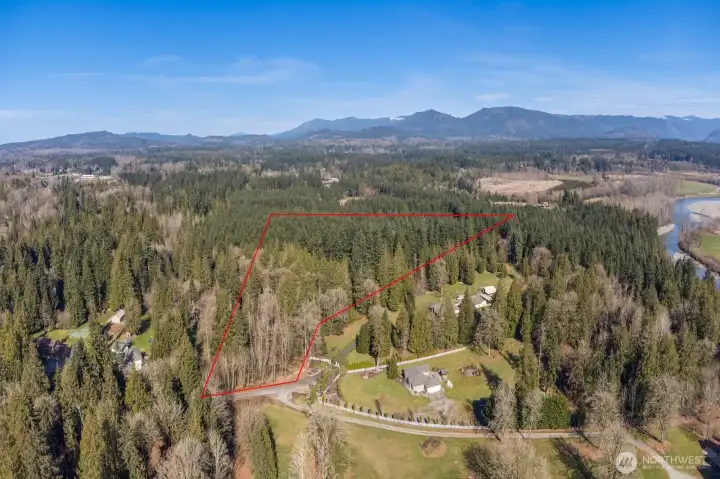 Bounday is approximate. The back side of property backs up to a tree farm. Note the Stilliguamish River to the right. The community has community access to the river.