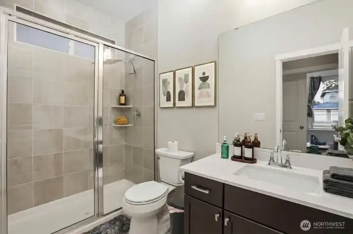 Main level 3/4 bath (digitally staged)