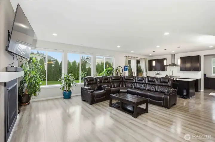 Open concept living flows to the kitchen and dining room.