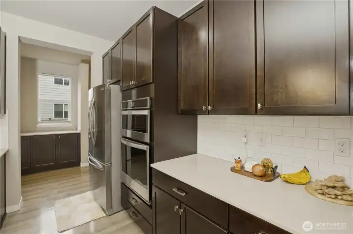 Kitchen and then there is an incredibly spacious butler's pantry and mudroom just around the corner!