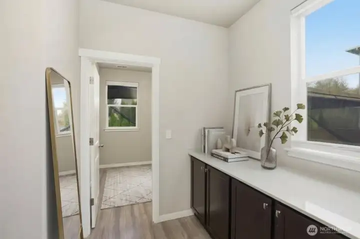 Butler's pantry and door to main pantry area. This would be great for a coffee bar! (some items digitally staged)