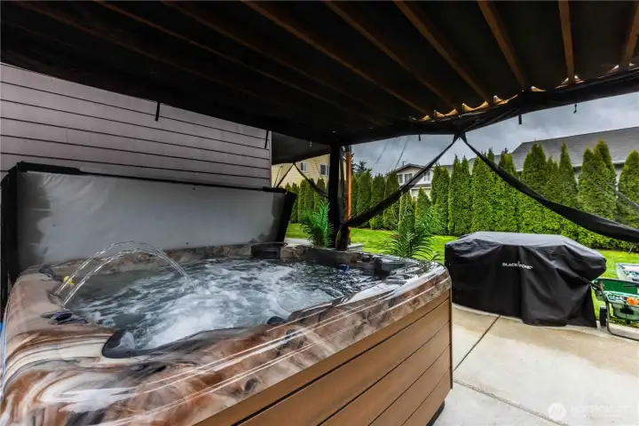 Second pergola covers this amazing 7 person hot tub on the expanded patio! I feel relaxed already!