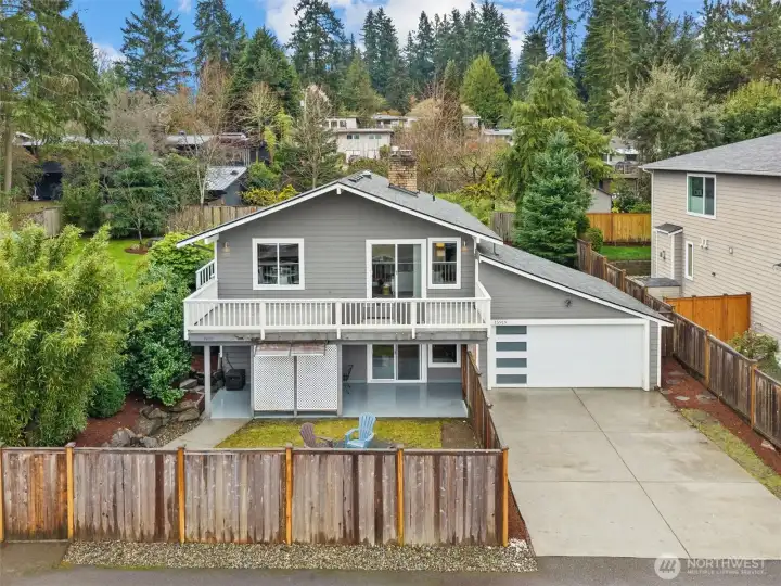 Front exterior of home on a large private cul-de-sac lot, featuring attached 2-car garage, expansive driveway, and elevated setting with territorial views.