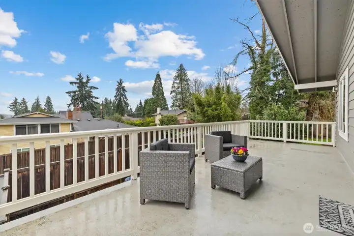 Spacious entertainment deck off the main living area, perfect for outdoor dining, relaxing, and enjoying northwest-facing territorial views.