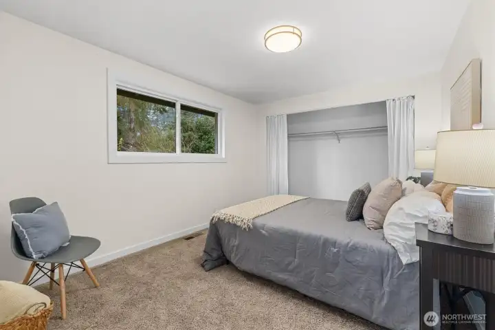 Bedroom with soft natural light, neutral finishes, and comfortable layout ideal for guests, office use, or everyday living.