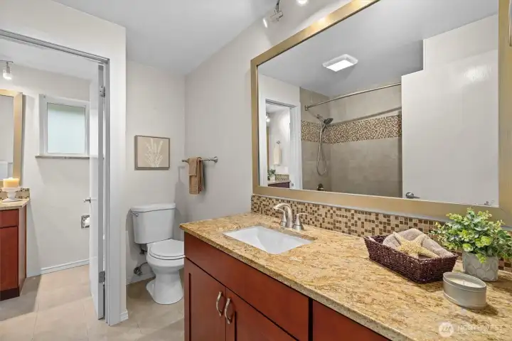 Well-appointed bath with extended vanity, updated fixtures, and stylish finishes for everyday comfort.