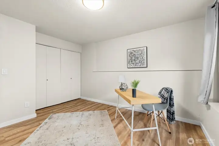 Versatile room with closet and clean modern finishes, ideal as a home office, guest bedroom, or workout space.