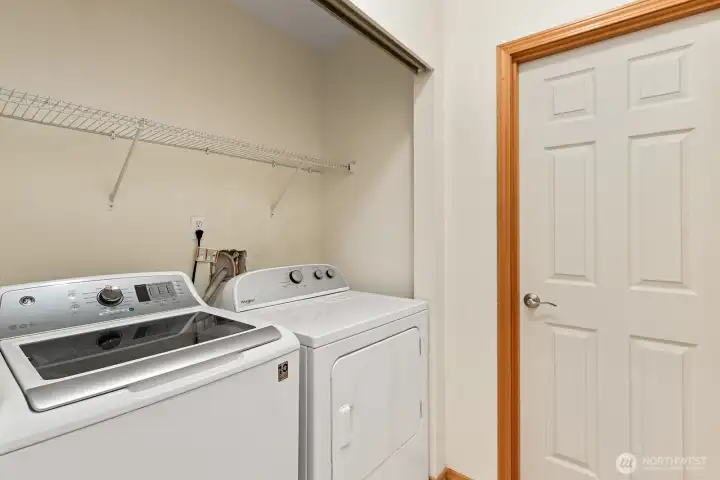 Laundry closet off of kitchen.