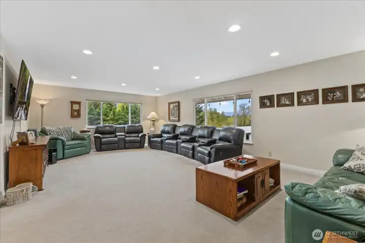 Spacious living room with expansive windows and endless potential to make it your own.