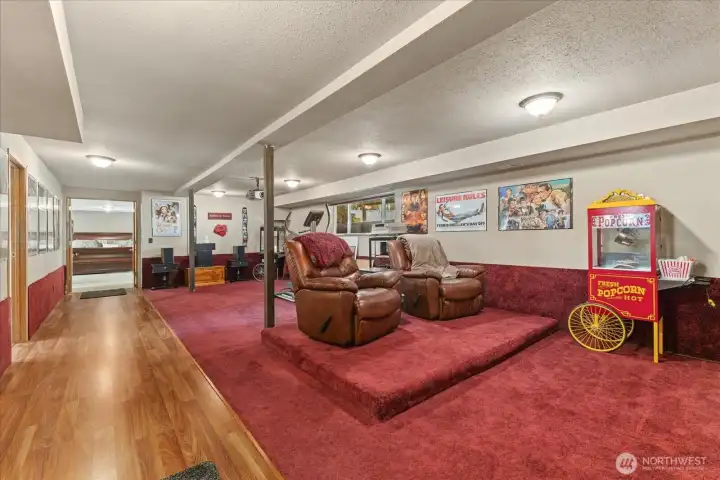 Lower-level media room complete with projector setup for movie nights