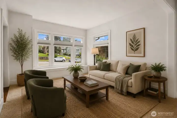 Bright living room filled with natural light and comfortable gathering space. Virtually staged.