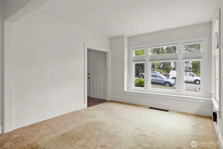 Generous living area with abundant natural light and flexible furniture placement.