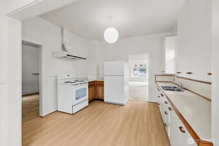 Bright kitchen with easy access to living spaces and functional layout.