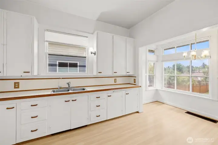 Sunny kitchen with neighborhood views and plenty of storage.