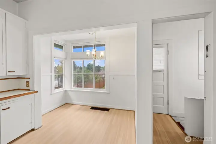 Kitchen leads to back entrance and basement.