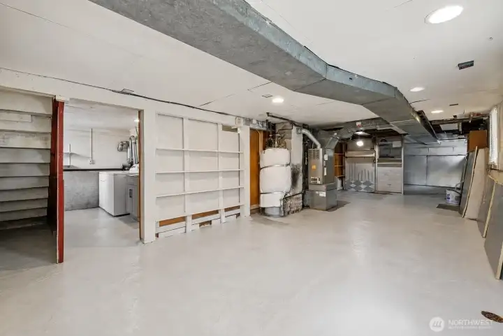 Unfinished basement with endless possibilities for expansion.
