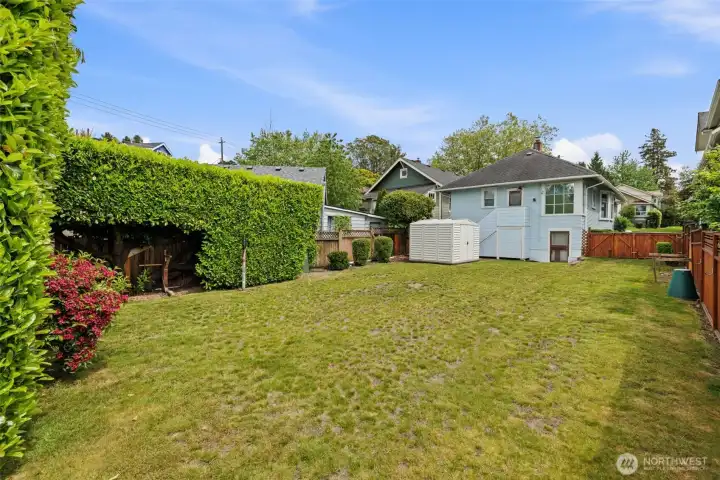 Expansive backyard with privacy and room to play.