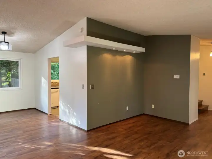 The living room wraps around into the dining space with easy access to the kitchen. The living room wraps around into the dining space with easy access to the kitchen.