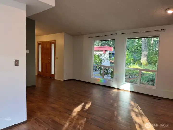 The expansive living room windows allow you to take in the beauty of the trees in front while also allowing for a great cross breeze. The expansive living room windows allow you to take in the beauty of the trees in front while also allowing for a great cross breeze.