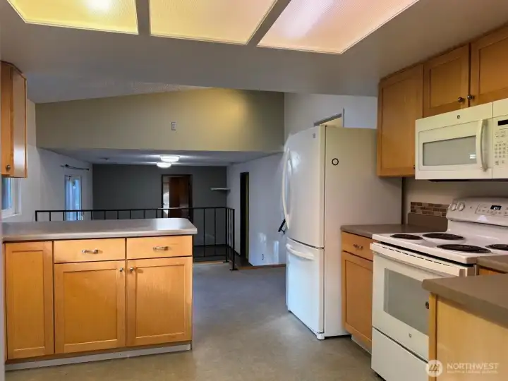 The placement of the kitchen makes it accessible to both eating areas as well as the family room down below. The placement of the kitchen makes it accessible to both eating areas as well as the family room down below.