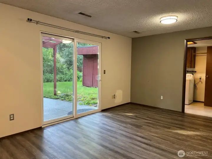 The family room opens out onto the lower-level patio and connects to the laundry room and half bath. The family room opens out onto the lower-level patio and connects to the laundry room and half bath.