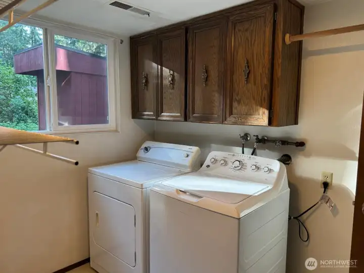 Plenty of space for storage and hanging laundry. Plenty of space for storage and hanging laundry.
