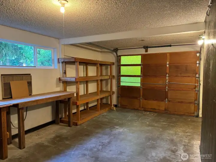 The garage has plenty of storage here and around the corner. The garage has plenty of storage here and around the corner.