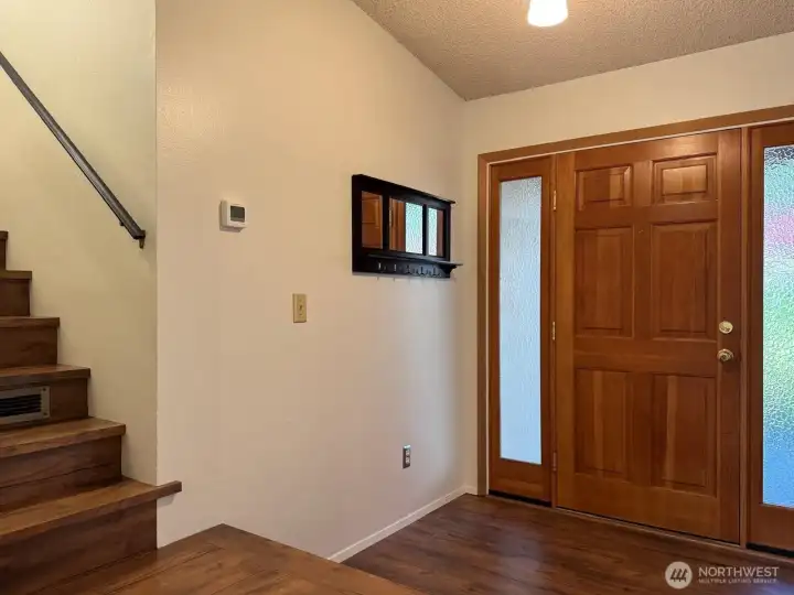 A beautiful front door leads into an open and welcoming home. A beautiful front door leads into an open and welcoming home.