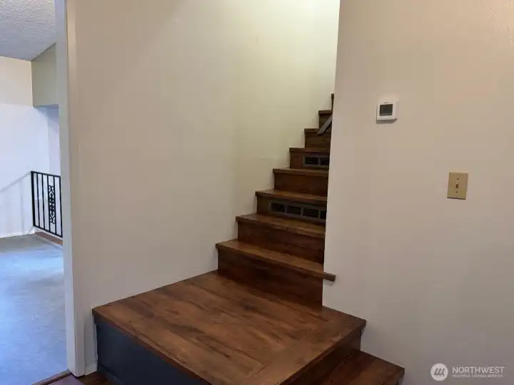 The landing and stairs lead to the primary bedroom, two additional bedrooms and full bath. The landing and stairs lead to the primary bedroom, two additional bedrooms and full bath.