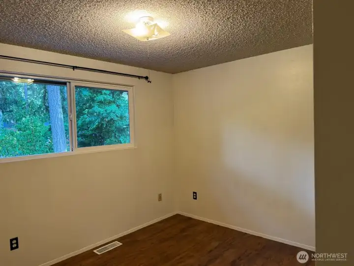 The first bedroom has ample light looking over the front. The first bedroom has ample light looking over the front.