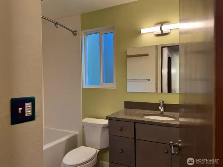 This updated bathroom serves both bedrooms. This updated bathroom serves both bedrooms.