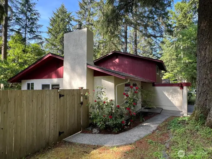 The front sidewalk leads from front door to additional side patio space. The front sidewalk leads from front door to additional side patio space.