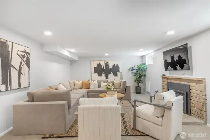 Rec room in the lower level with gas fireplace. Rec room in the lower level with gas fireplace.