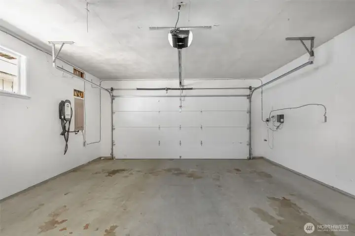 Two car garage with EV charging- entrance into the home so you can stay dry and warm in the winter! Two car garage with EV charging- entrance into the home so you can stay dry and warm in the winter!